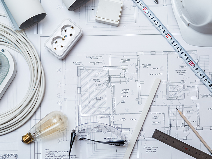 Close-up of residential electrical blueprint showing detailed wiring layout.