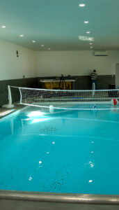 Completed indoor pool in Kennewick WA with recessed lighting and electrical systems installed by Tadeo Electric LLC.