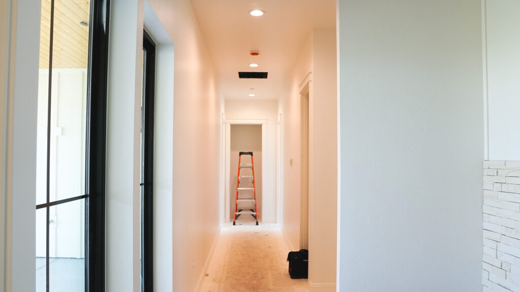 Finished hallway in West Richland WA dream home with recessed lighting installed by Tadeo Electric LLC.